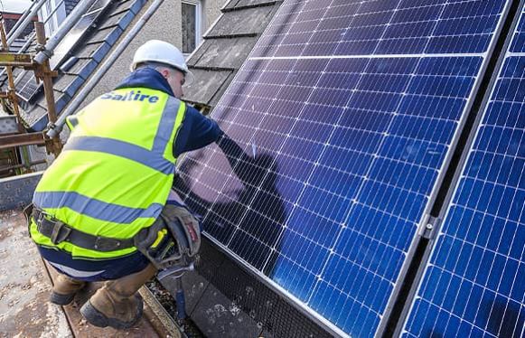 Apprentice fitting solar panel