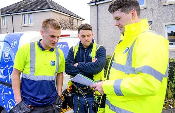 family keeping warm under blankets