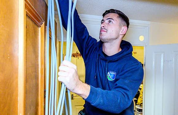 family keeping warm under blankets