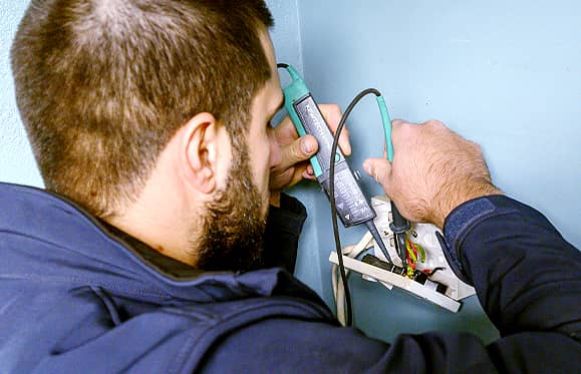 Electrician working on socket