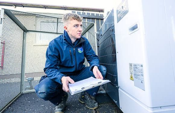 Apprentice checking heater